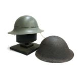 A pair of WWII military helmets