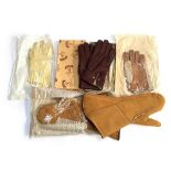 A pair of sheepskin driving gauntlets, a pair of mustard string hunting gloves, a pair of leather