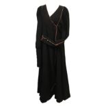 A Bill Gibb of London black wraparound kaftan style dress, the long cuffs each with five enamel