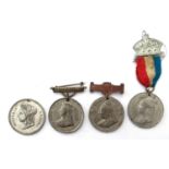 A collection of four commemorative Queen Victoria medals, a Church of England Sunday School