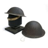 A further pair of military helmets