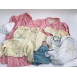 A pink gingham jacket and skirt, together with various vintage baby outfits, some from Givans of New