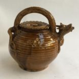 A large Chinese dragon-handled pottery teapot