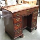 A ladies kneehole desk/dressing table, with traditional arrangement of seven drawers, the first with