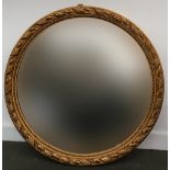 A large circular hall mirror with gilt decoration, the glass 64cmD