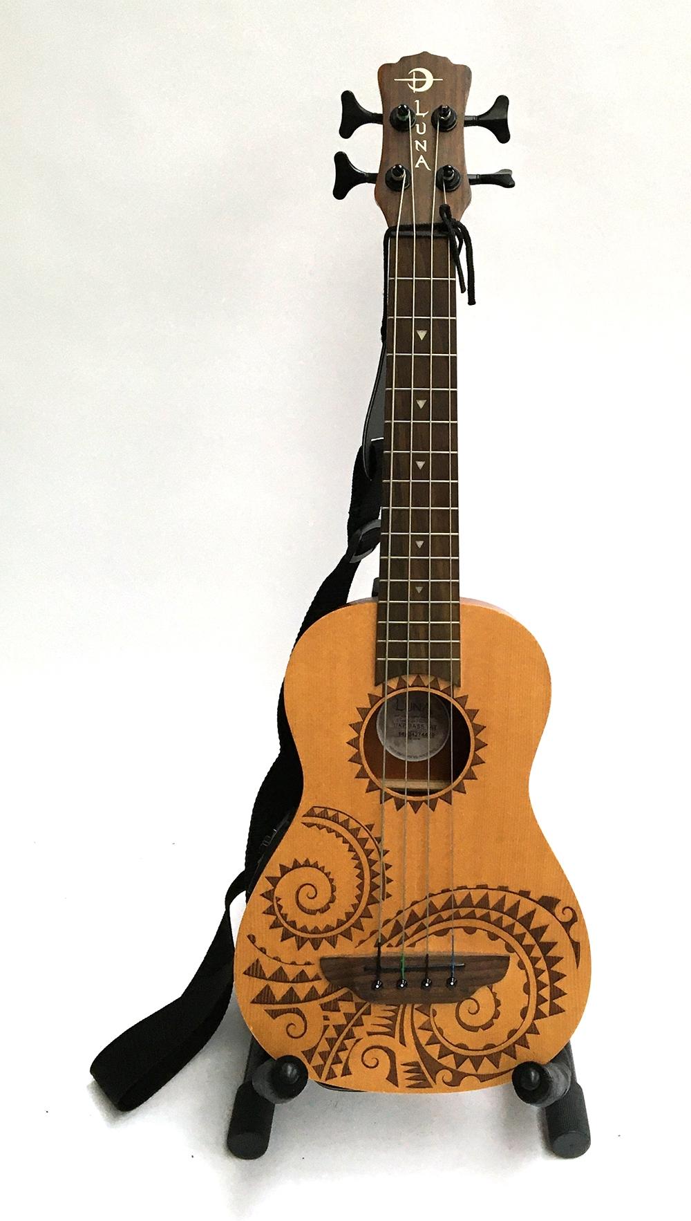 A Luna electro-acoustic bass ukulele, in a Luna Ukes soft case