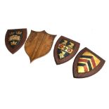 Three hand painted wooden shields, one the Oxford University crest, each 30cmH; together with a