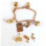 9ct gold charm bracelet with 5 charms plus heart padlock together with 3 further yellow metal charms