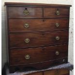 An early 19th century mahogany bowfront chest of two short over three graduating drawers, on