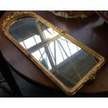 A modern gilt framed wall mirror, with domed top, 86x33cm