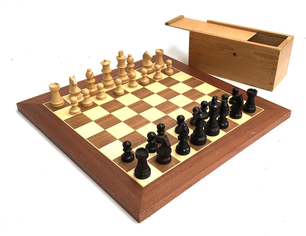 A complete wooden chess set and board, the board 40cm2