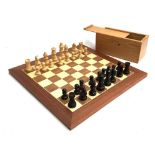 A complete wooden chess set and board, the board 40cm2