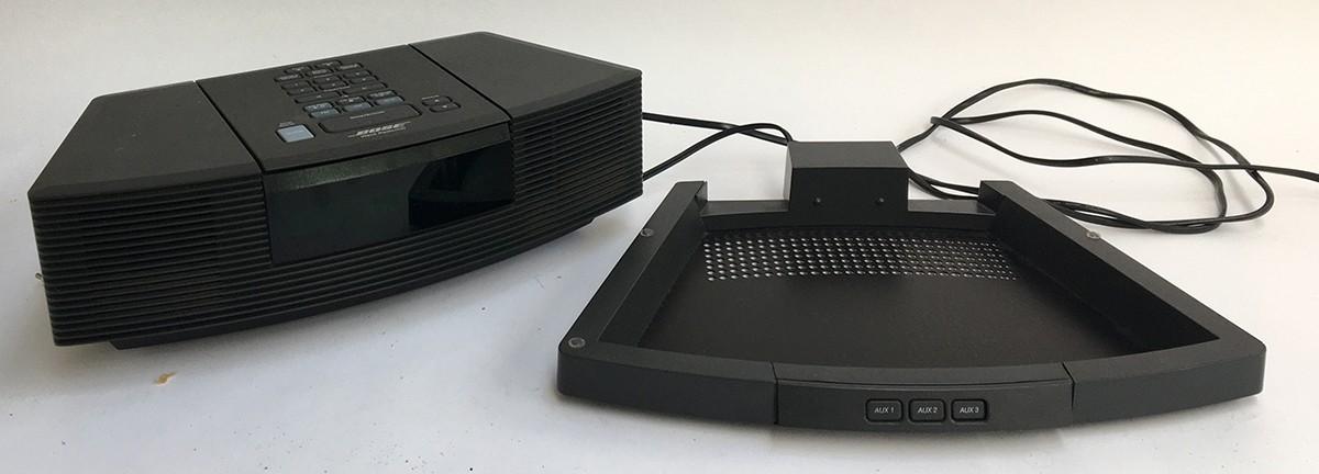 A Bose Wave CD player/radio, boxed; together with a Bose Wave pedestal