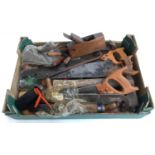 A mixed box of vintage hand tools to include various saws, one by Spear & Jackson, lock plane,