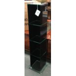 A set of three black glass shelving units, each 18x19x97cmH, new in original boxes