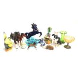 A mixed lot of mostly ceramic figurines to include multiple horse figurines including Beswick