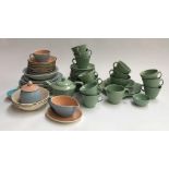 A Woods ware part tea set; together with a quantity of Poole pottery, to include plates, bowls,