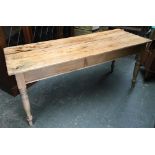 A pine farmhouse kitchen table, with single end drawer, on turned legs, 167x63x73cmH