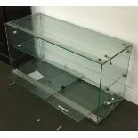 An Italian glass display case with sliding doors, lock and key, 80x30x40cmH