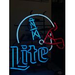 An American neon bar sign 'LITE' below an American football helmet, with a 'step down and step up