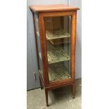 A 19th century glazed display cabinet, crossbanded, glazed on three sides, on square tapered legs