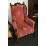 A 20th century armchair on cabriole legs