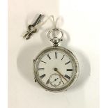 A large open face key wind pocket watch, white dial with Roman numerals and outer minutes track,