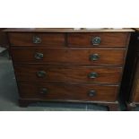 A late 19th/early 20th century mahogany chest of two short over three graduating drawers, on bracket