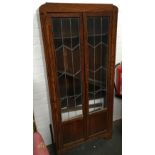 A 20th century oak glazed display cabinet, with key, 76cmW, 168cmH