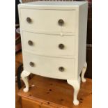A 20th century bowfront bedside cabinet of three drawers on cabriole legs, painted pale blue, 74cmH