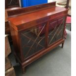 A glazed mahogany display cabinet, with key and checkered banding, 122cmW