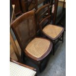 Two caned occasional chairs