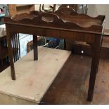A mahogany butlers tray table, with cutout carry handles, 66x42x55cmH