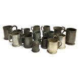A lot of pewter tankards to include quart and pint measures, some with glass bottoms, one horn