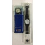 A Swatch quartz watch, new in hard plastic case; together with a Swatch 'Irony Scuba' watch, in