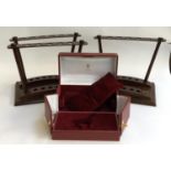 An Asprey presentation box; together with two Asprey wooden stands