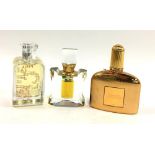 A bottle of Unveil Ajmal perfume; Pyxis 100ml; and Tom Ford Sahara Noir 50ml eau de parfum