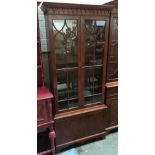 A glazed display cabinet, cupboard door below, 79x189cmH