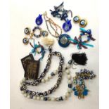 A lot of Turkish evil eye glass beads and jewellery, glass fish, several wallets etc