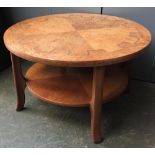 A mid-century circular coffee table with quartered top, 86cmW