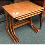 A nest of three mid-century tables, the largest 56cmW