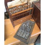 A two sectioned magazine rack; together with a wooden carved Gothic style mirrored panel, 40x23cm