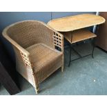 A wicker conservatory armchair, together with similar table with undershelf
