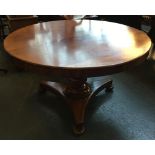 A circular mahogany breakfast table, on heavy column and triform base, 132cmW