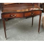 A 20th century mahogany three-quarter galleried desk, serpentine front, with two drawers, on