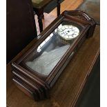 A modern wall clock with pendulum and key, marked 'Hermle', 68cmH