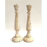 Two turned wood candle holders