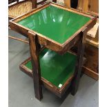 A two tiered occasional table with inset green glass tops, 37x37x59cmH