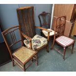 A 19th century open armchair with caned seat and back; together with three occasional chairs