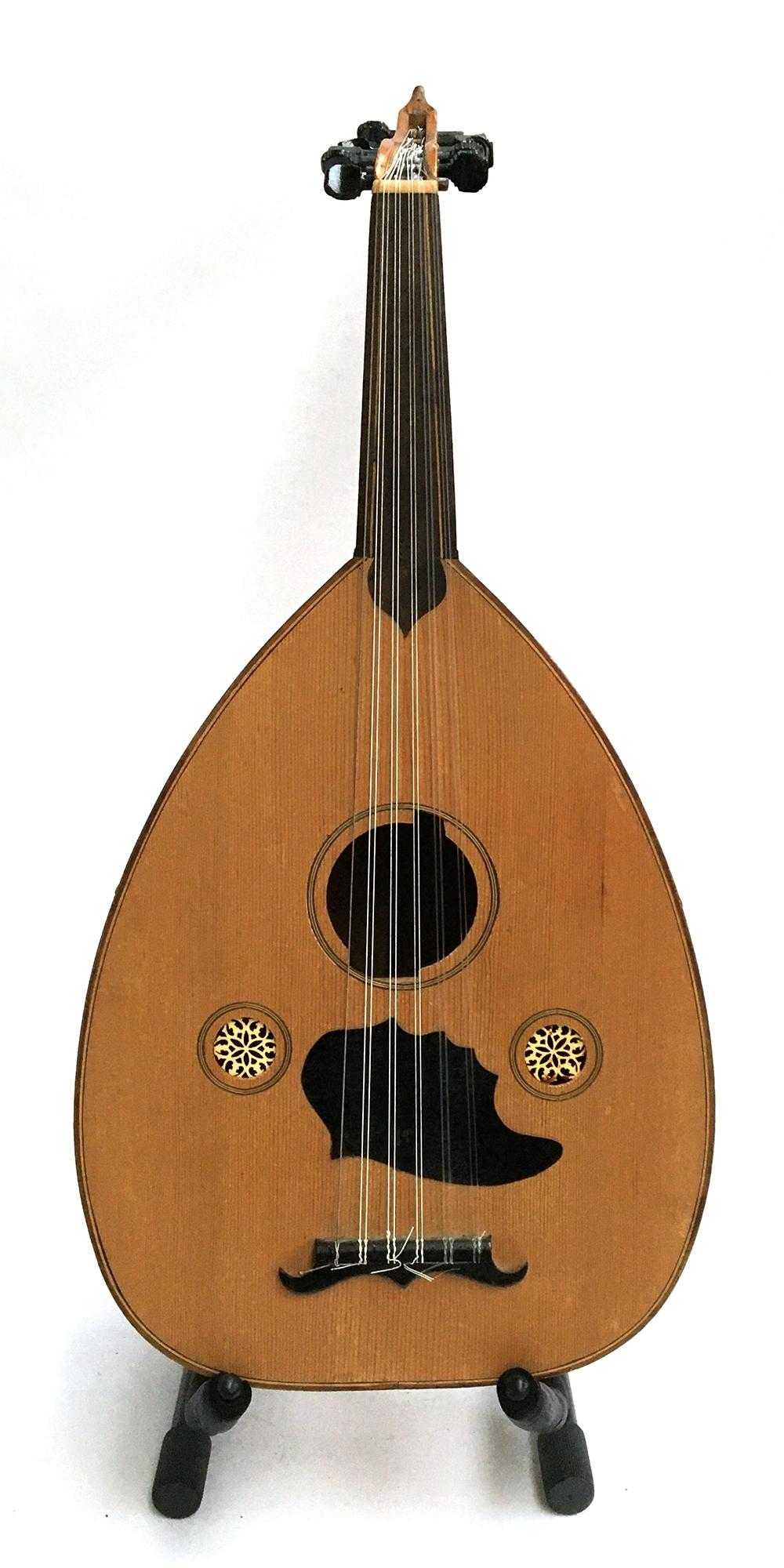 A bowlback 12 string Oud, with a soft case